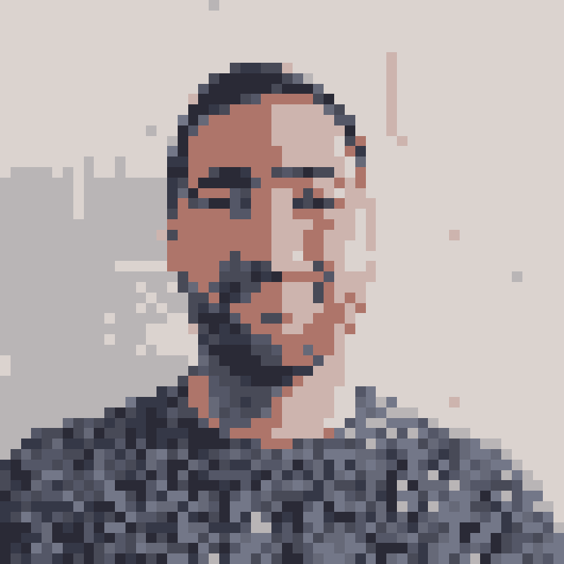 Pixelated image of Daniel. Shows a youngish white make with short beard and a bluish jumper.